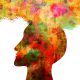 colorful graphic of a human head in profile with thought clouds bursting overhead